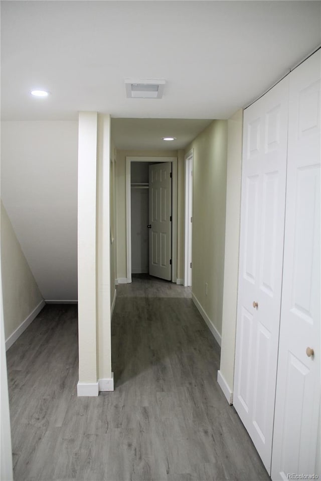 hall with light hardwood / wood-style floors