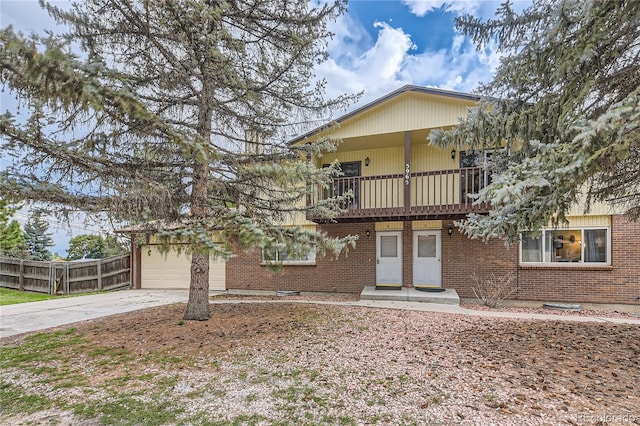 view of front of property with a balcony and a garage