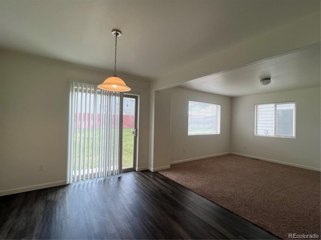 522 Foxtail Pl, Wiggins, CO 80654 - unfurnished room featuring baseboards and dark wood-style floors