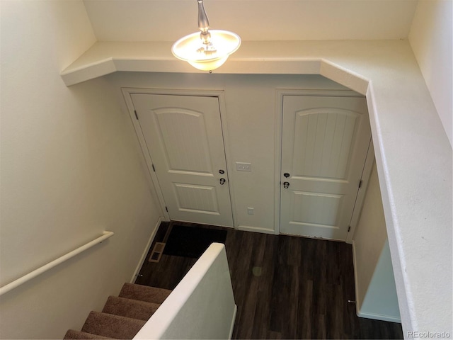 522 Foxtail Pl, Wiggins, CO 80654 - stairway featuring wood finished floors
