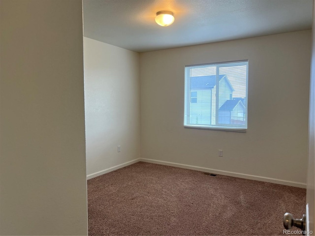 522 Foxtail Pl, Wiggins, CO 80654 - spare room featuring carpet and baseboards