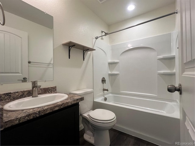 522 Foxtail Pl, Wiggins, CO 80654 - bathroom with vanity, toilet, shower / tub combination, and wood finished floors