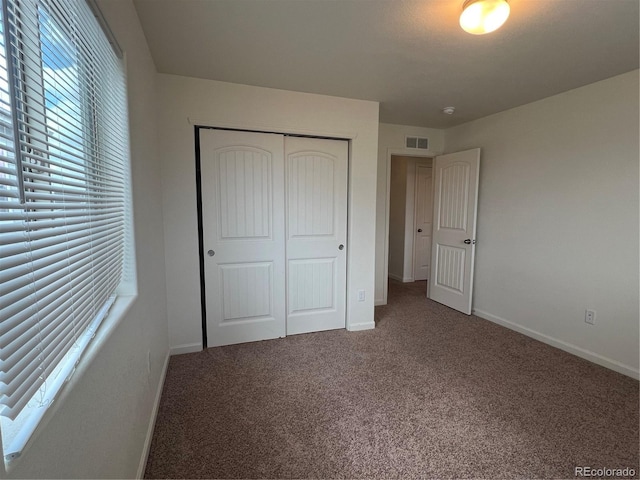 522 Foxtail Pl, Wiggins, CO 80654 - unfurnished bedroom with a closet, carpet, and baseboards