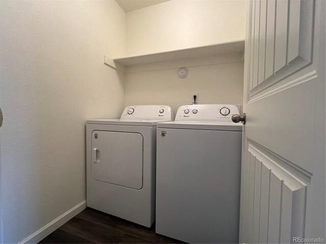 522 Foxtail Pl, Wiggins, CO 80654 - laundry room with washer and clothes dryer, dark wood-style flooring, and baseboards