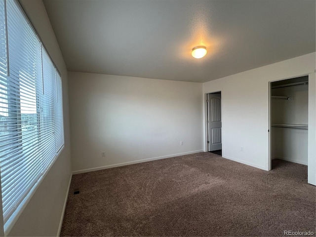 522 Foxtail Pl, Wiggins, CO 80654 - unfurnished bedroom with carpet, baseboards, and a closet