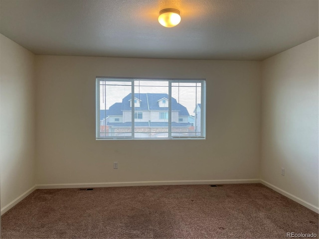522 Foxtail Pl, Wiggins, CO 80654 - empty room featuring carpet floors and baseboards