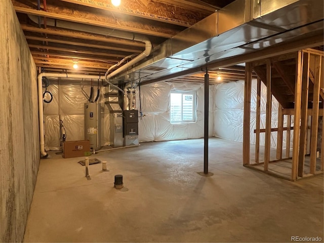 522 Foxtail Pl, Wiggins, CO 80654 - basement featuring electric water heater and heating unit