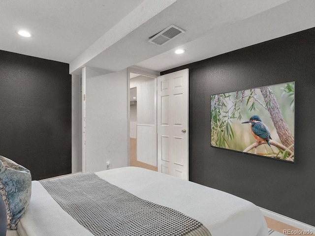 bedroom with hardwood / wood-style floors