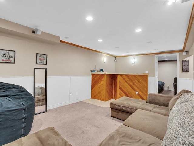 living room with crown molding and light colored carpet