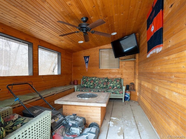 interior space featuring ceiling fan and an outdoor fire pit