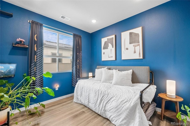 bedroom featuring hardwood / wood-style floors