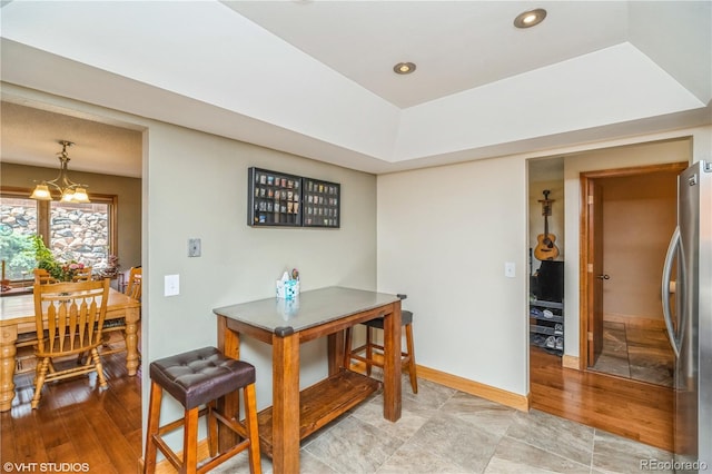 155 Xenon St Unit 33, Lakewood, CO 80228 - dining space with a raised ceiling, baseboards, recessed lighting, and light wood finished floors
