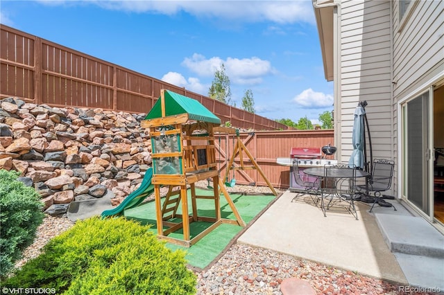 155 Xenon St Unit 33, Lakewood, CO 80228 - view of patio featuring fence and a playground