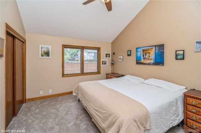 155 Xenon St Unit 33, Lakewood, CO 80228 - carpeted bedroom featuring vaulted ceiling, ceiling fan, baseboards, a closet, and a textured ceiling