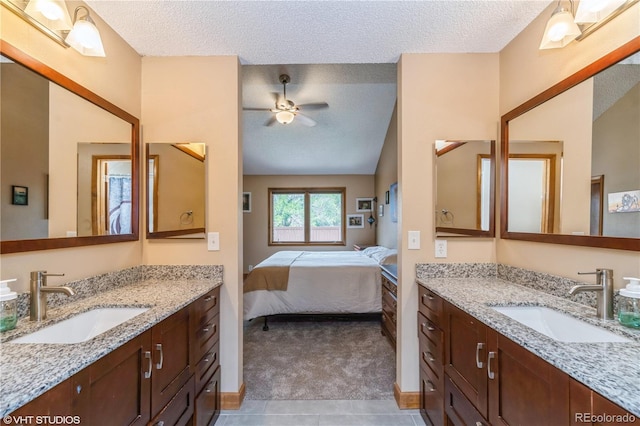155 Xenon St Unit 33, Lakewood, CO 80228 - ensuite bathroom with a textured ceiling, ceiling fan, and two vanities