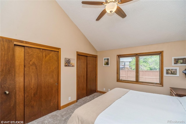 155 Xenon St Unit 33, Lakewood, CO 80228 - bedroom featuring carpet floors, multiple closets, high vaulted ceiling, a ceiling fan, and a textured ceiling