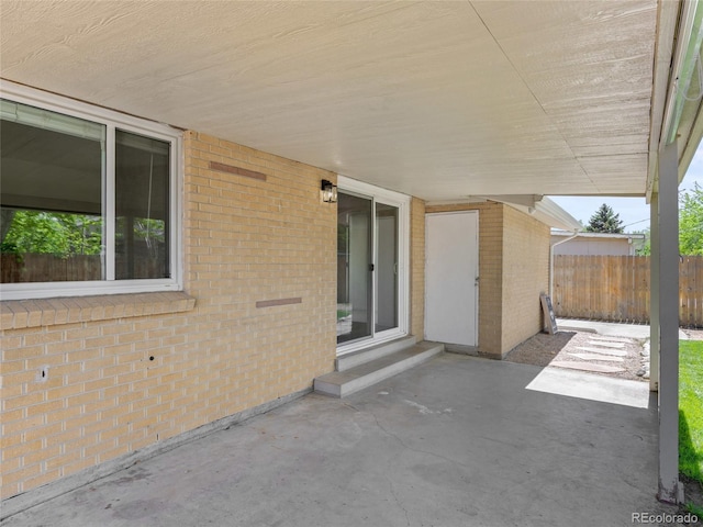 view of patio featuring fence