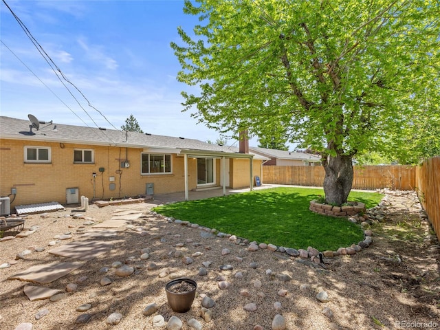 rear view of property featuring a patio area and central AC