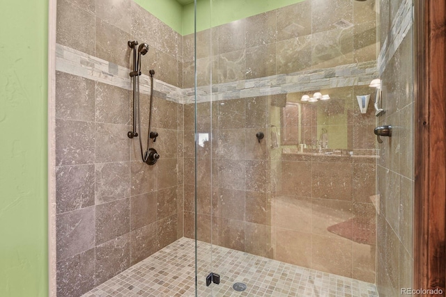 bathroom featuring a shower with door