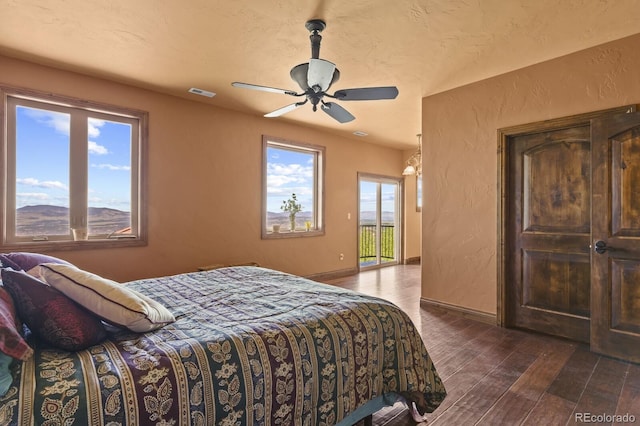 bedroom featuring dark hardwood / wood-style floors and ceiling fan