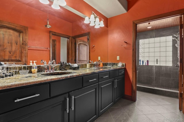 bathroom with dual bowl vanity and tile flooring