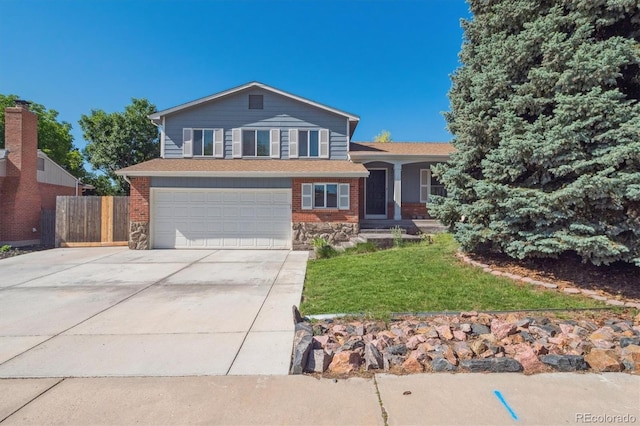 9442 W Walden Ave, Littleton, CO 80128 - split level home featuring driveway and an attached garage