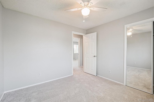 9442 W Walden Ave, Littleton, CO 80128 - unfurnished bedroom featuring carpet floors, a closet, a textured ceiling, and a ceiling fan