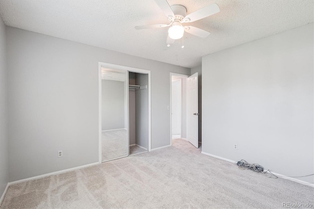 9442 W Walden Ave, Littleton, CO 80128 - unfurnished bedroom with carpet floors, a closet, a textured ceiling, and a ceiling fan