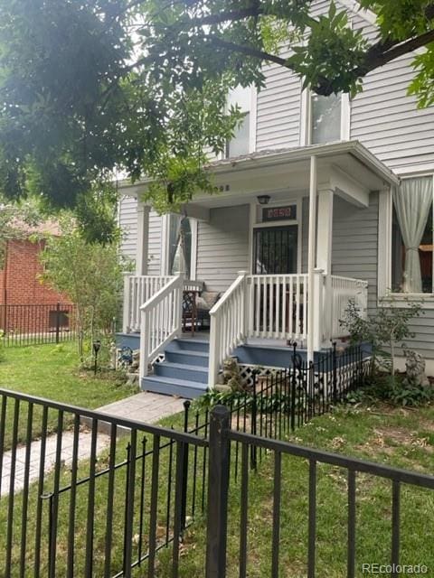 3098 W 39th Ave, Denver, CO 80211 - view of exterior entry featuring a porch
