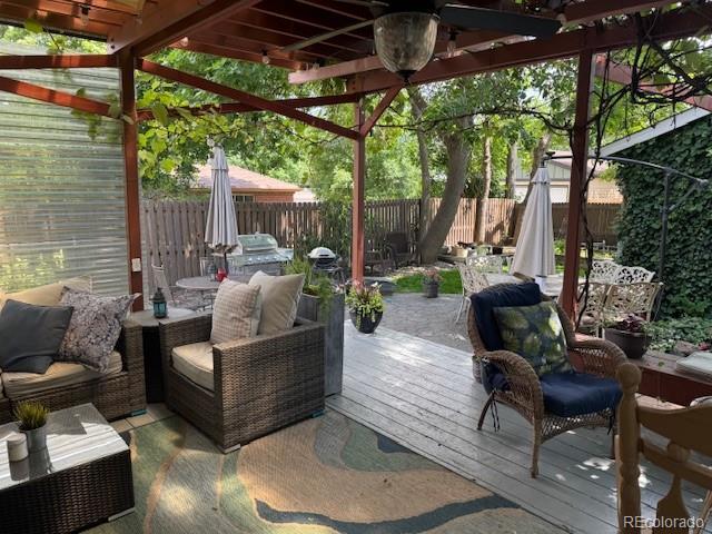 3098 W 39th Ave, Denver, CO 80211 - wooden deck featuring a fenced backyard, a pergola, and outdoor dining space