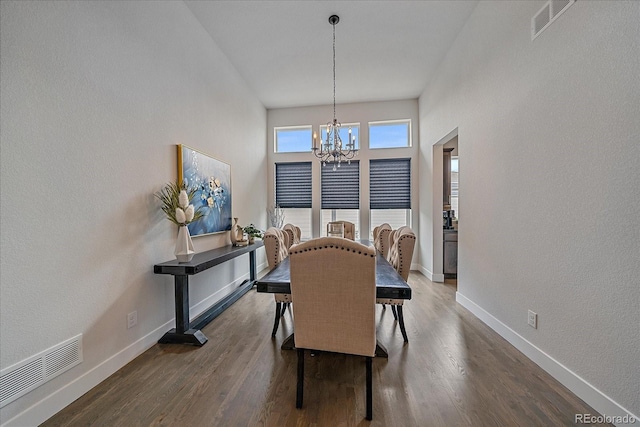 9433 Torrey Way, Arvada, CO 80007 - dining space with a chandelier, baseboards, and wood finished floors