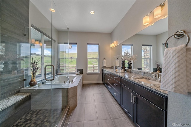 9433 Torrey Way, Arvada, CO 80007 - full bathroom featuring double vanity, a garden tub, tile patterned flooring, recessed lighting, and a shower stall