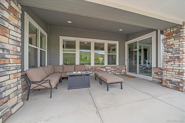 9433 Torrey Way, Arvada, CO 80007 - view of patio with an outdoor living space with a fire pit