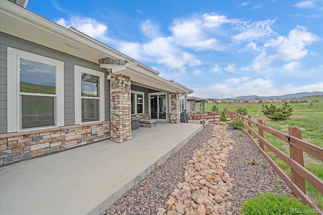 9433 Torrey Way, Arvada, CO 80007 - view of yard featuring a patio and a mountain view