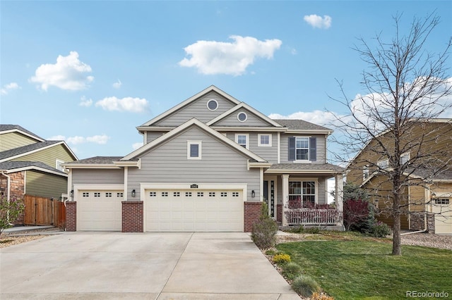 5362 E 140th Pl, Thornton, CO 80602 - craftsman-style house featuring fence, a front lawn, brick siding, a garage, and driveway