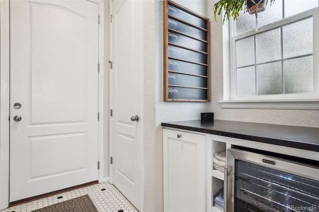 5362 E 140th Pl, Thornton, CO 80602 - interior space featuring beverage cooler and light tile patterned flooring