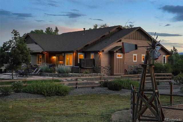 back house at dusk with a yard