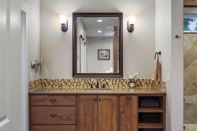 bathroom with vanity and backsplash