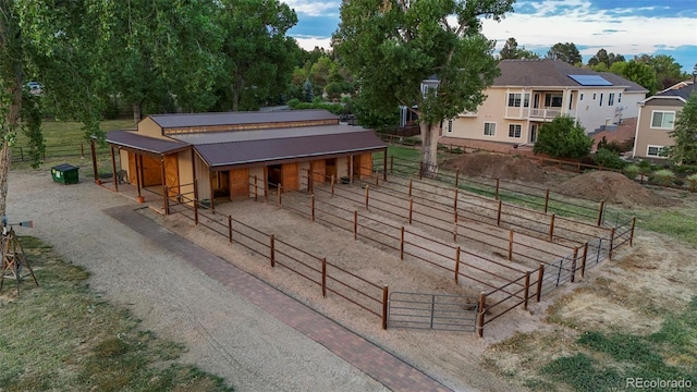 view of community featuring an outbuilding