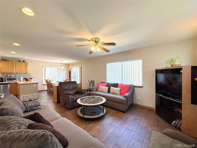 2835 S Tower Way, Aurora, CO 80013 - living area featuring ceiling fan, baseboards, wood finished floors, and recessed lighting