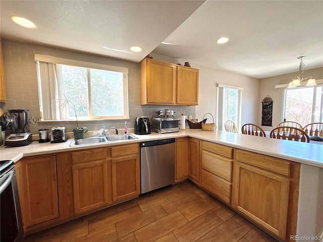 2835 S Tower Way, Aurora, CO 80013 - kitchen featuring appliances with stainless steel finishes, a sink, tasteful backsplash, light countertops, and recessed lighting