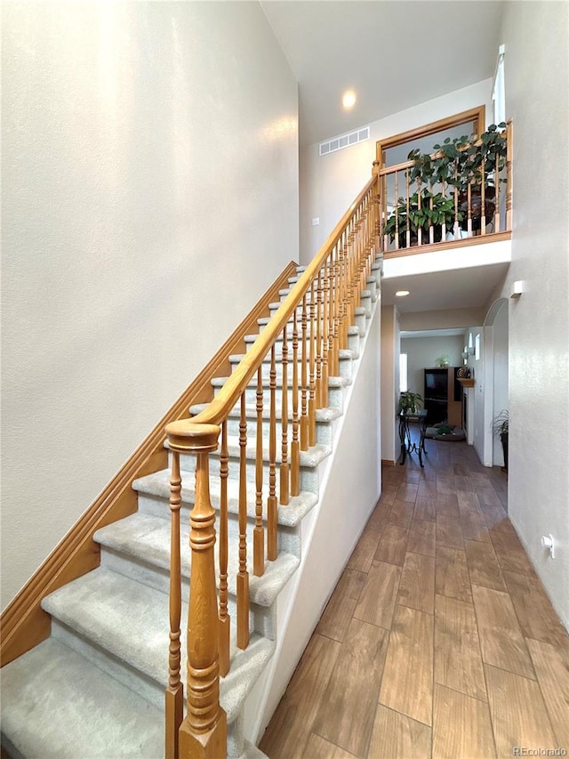 2835 S Tower Way, Aurora, CO 80013 - stairway with a towering ceiling and wood finished floors