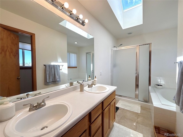 2835 S Tower Way, Aurora, CO 80013 - bathroom featuring a skylight, a garden tub, a shower stall, and double vanity