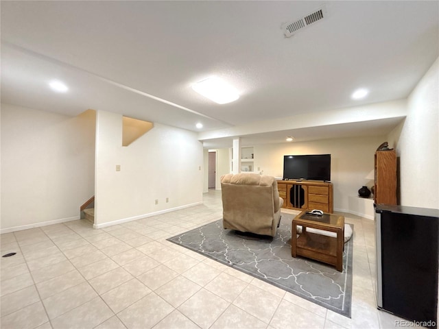 2835 S Tower Way, Aurora, CO 80013 - living area with stairway, tile patterned flooring, recessed lighting, and baseboards