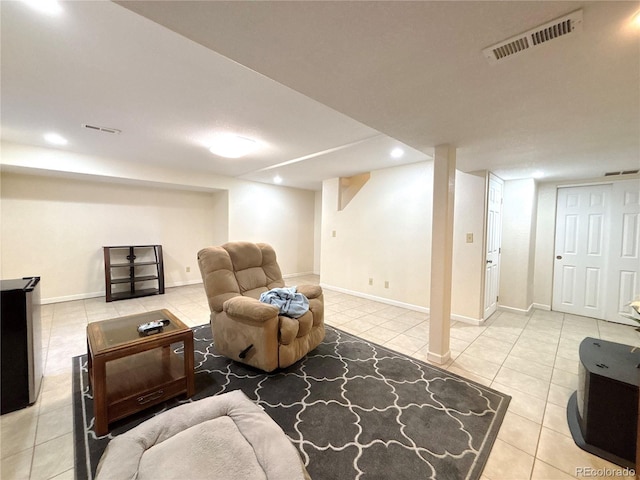 2835 S Tower Way, Aurora, CO 80013 - living room with tile patterned floors, baseboards, and recessed lighting