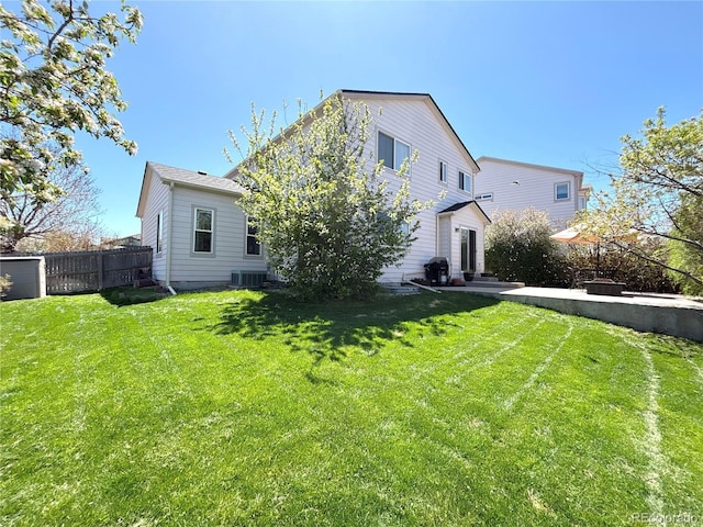 2835 S Tower Way, Aurora, CO 80013 - rear view of property featuring a patio area and central AC