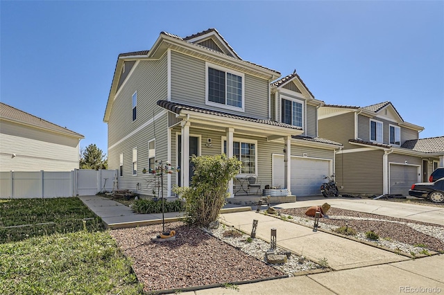 20530 Randolph Pl, Denver, CO 80249 - view of front facade with a porch, a garage, and driveway