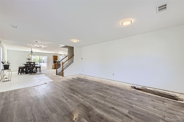 20530 Randolph Pl, Denver, CO 80249 - unfurnished living room featuring stairway and wood finished floors