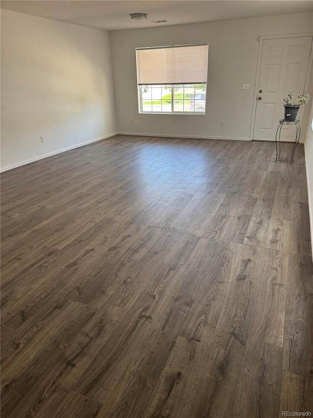 20530 Randolph Pl, Denver, CO 80249 - unfurnished room with dark wood-style flooring and baseboards