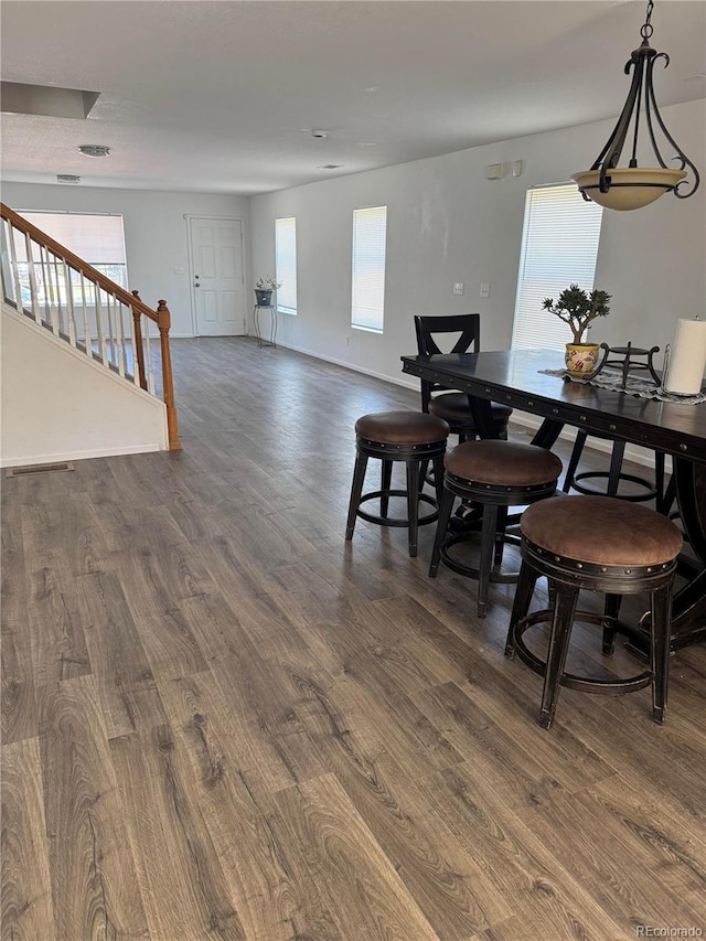 20530 Randolph Pl, Denver, CO 80249 - dining space featuring dark wood finished floors and stairs
